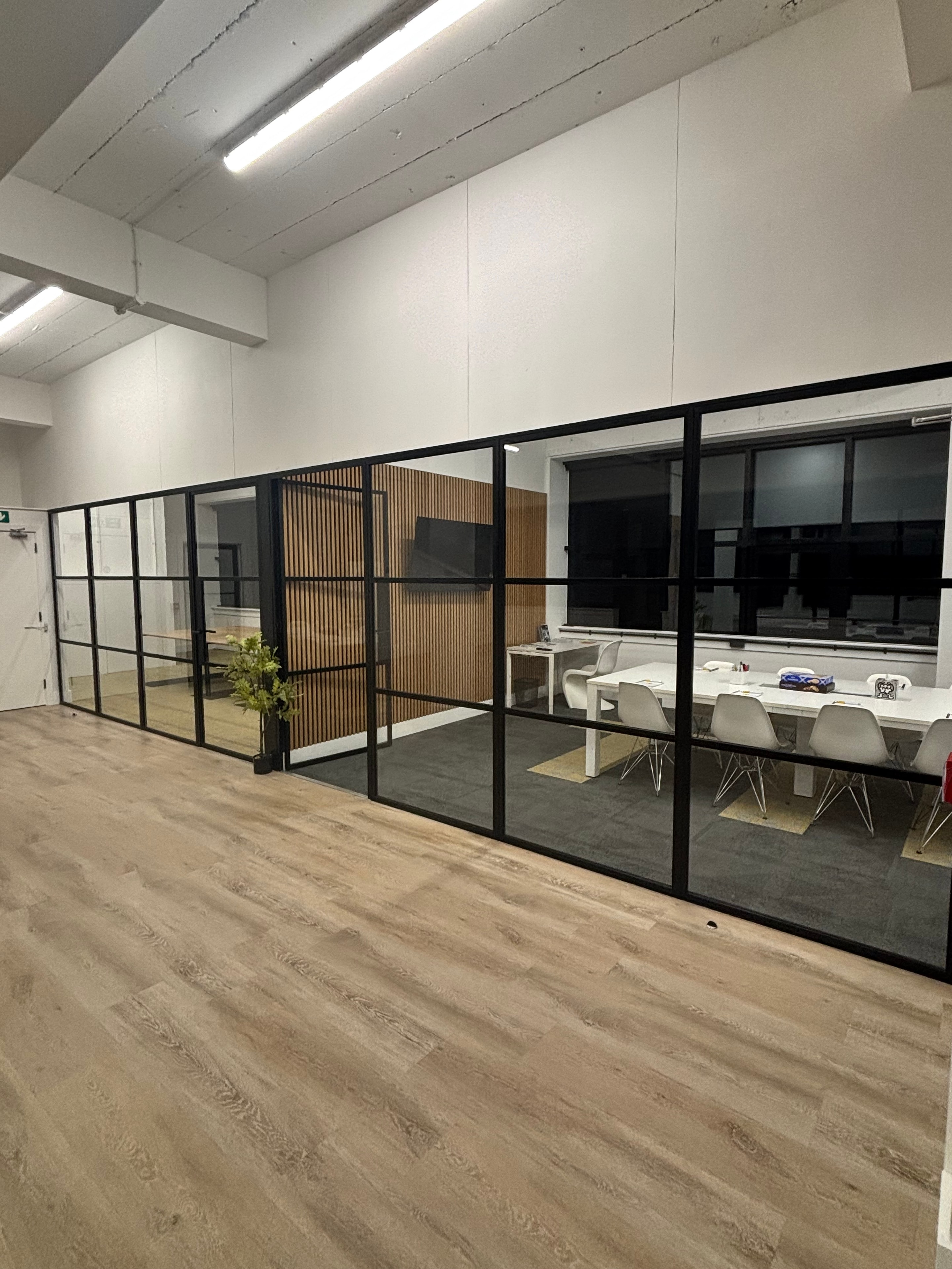 T10 campus glass partition corridor looking into training room