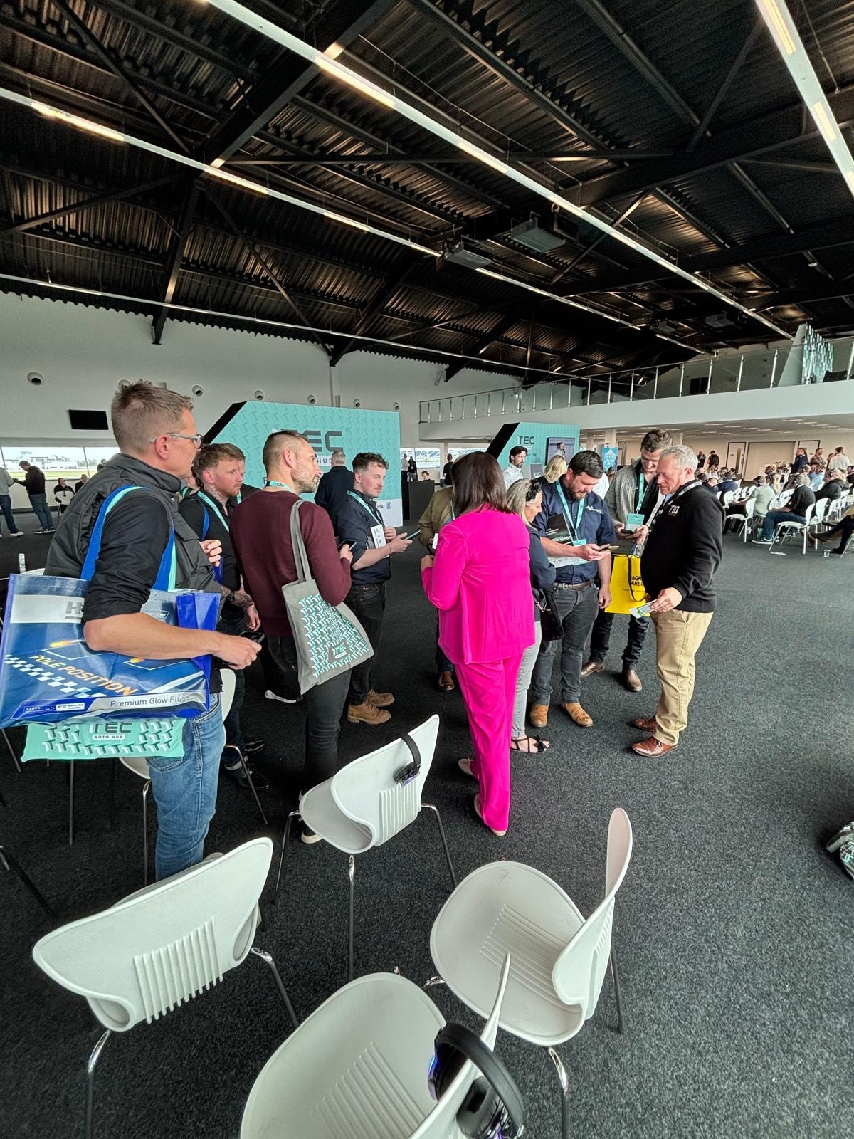 Lauren Brown presenting on stage at 1TEC Auto Hub Silverstone